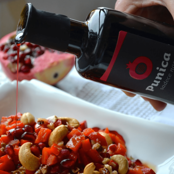 Punica Pomegranate Extract being poured onto food